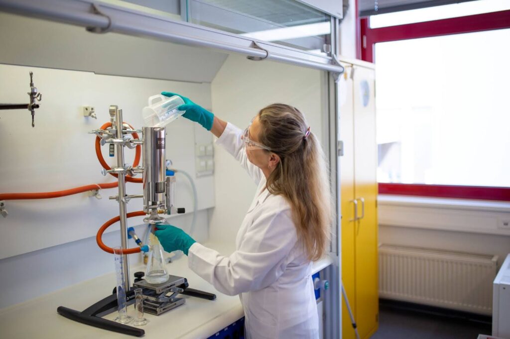 woman working on industrial filtration projects
