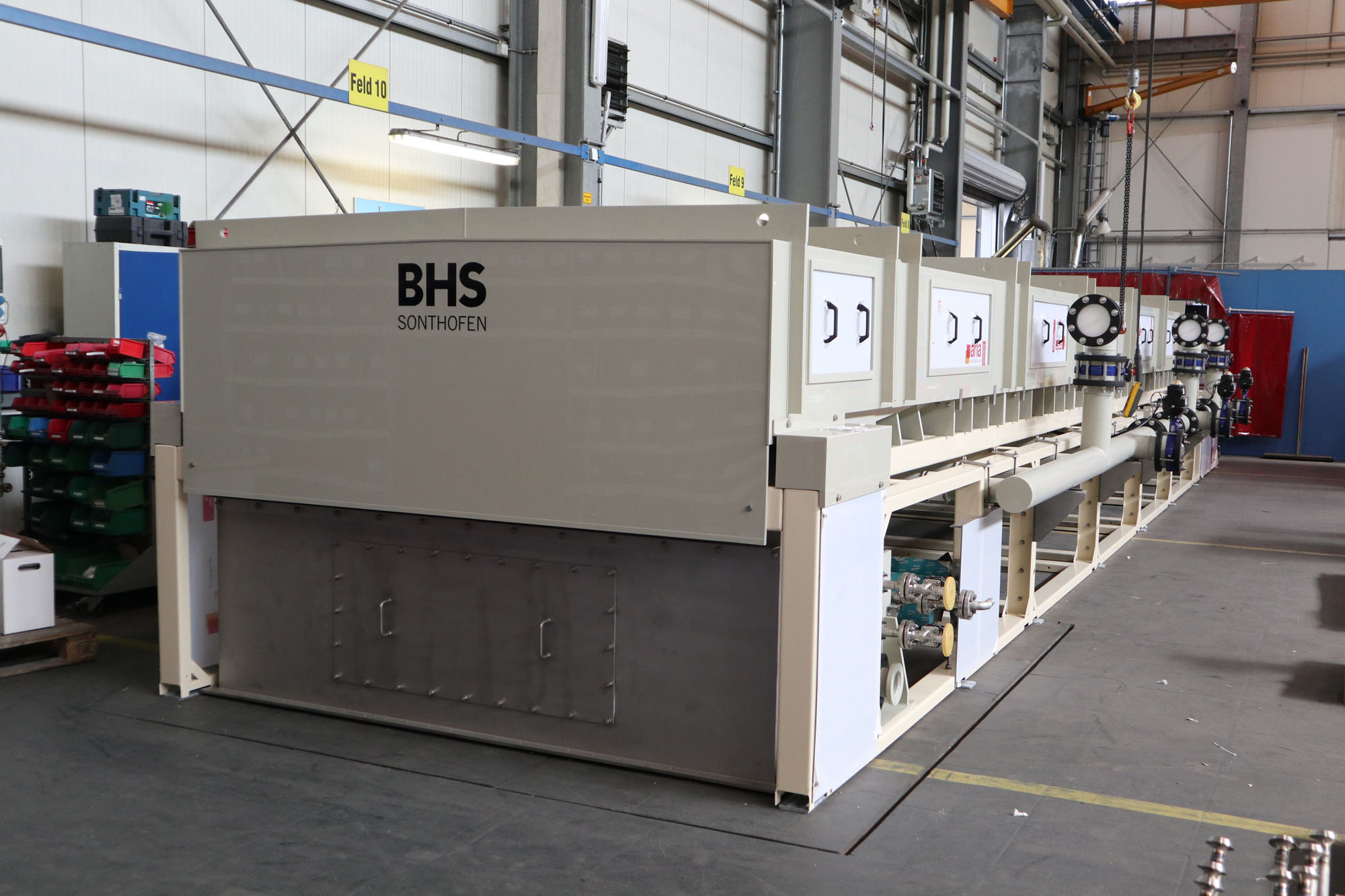 Industrial BHS belt filter machinery in a warehouse setting, BHS filtration technologies